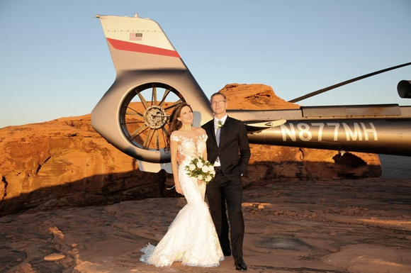 Bride and groom with helicopter pose - Amanda Miles Photography